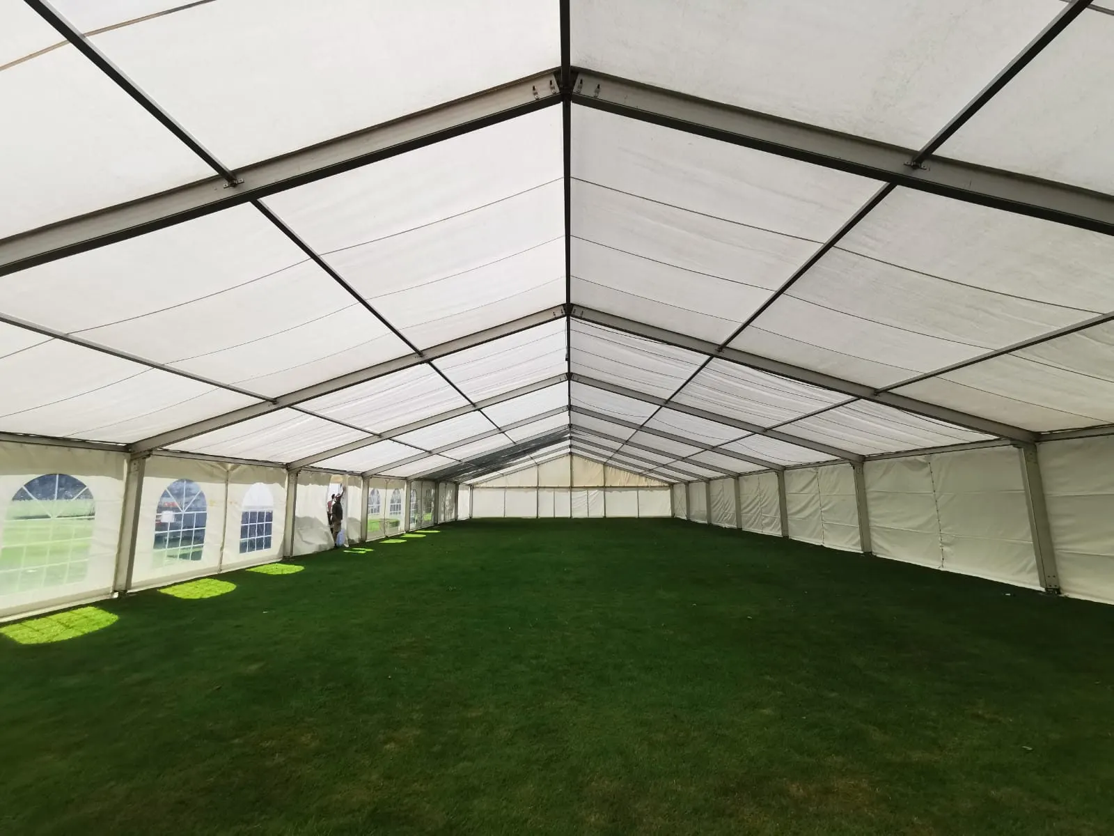 Inside a clearspan frame marquee