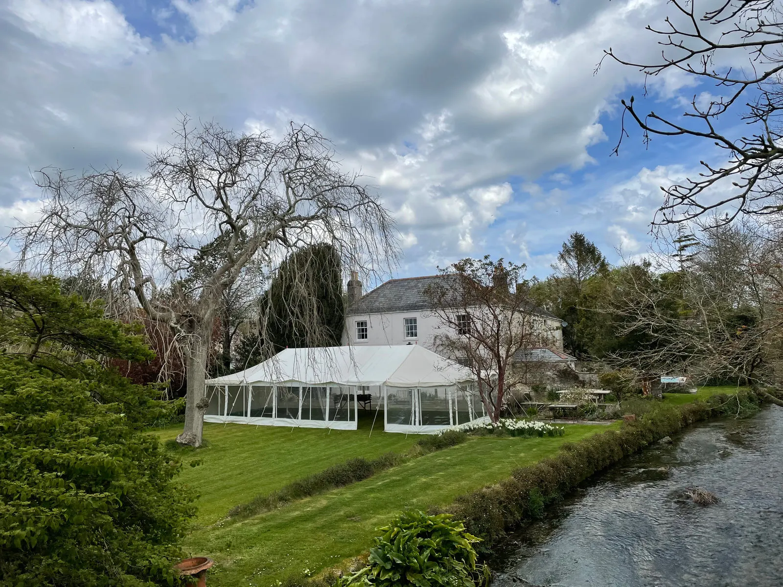 Marquee on a riverside lawn